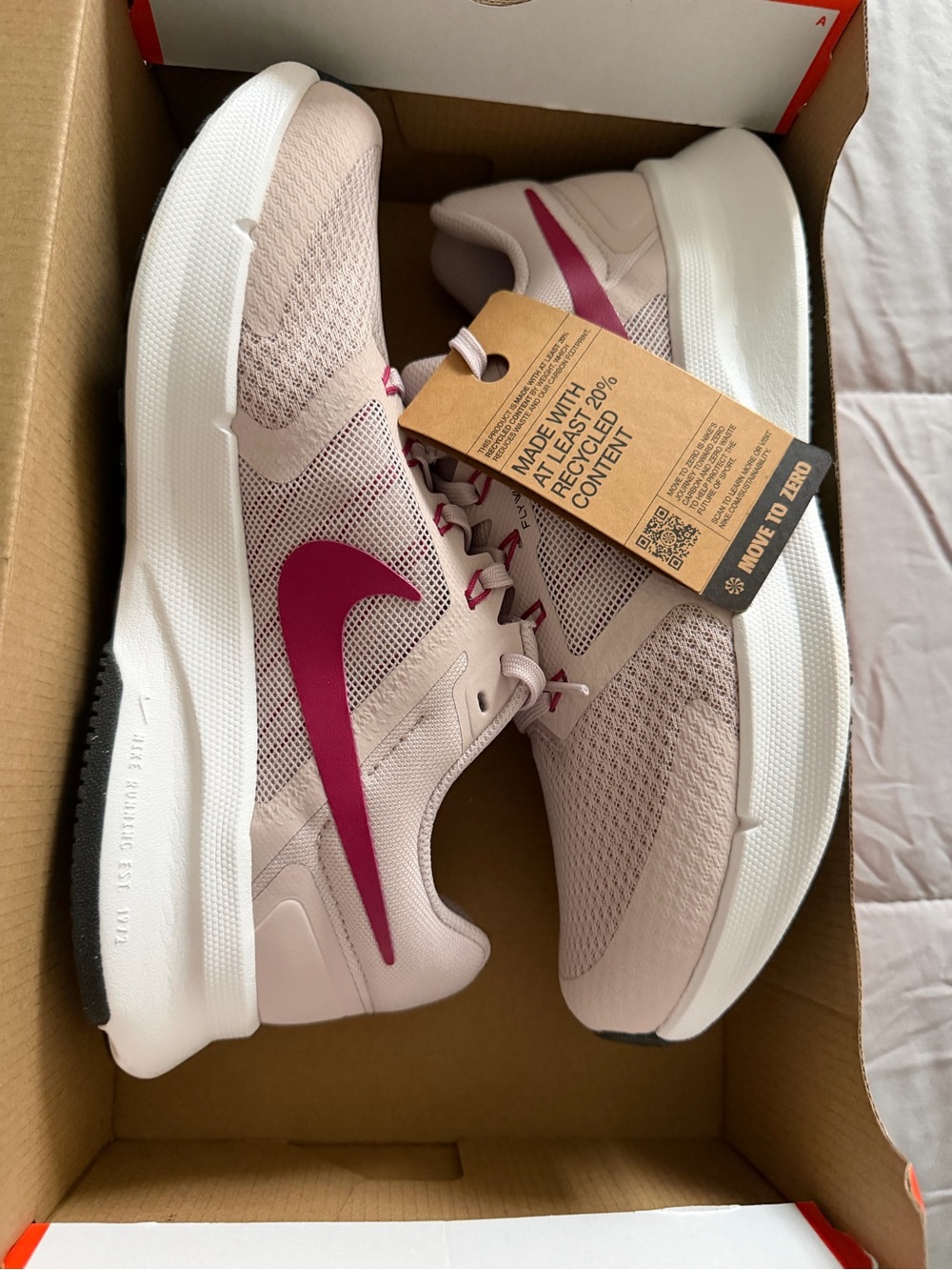 Nike Women's Light Pink Running Shoes with Dark Pink Swoosh